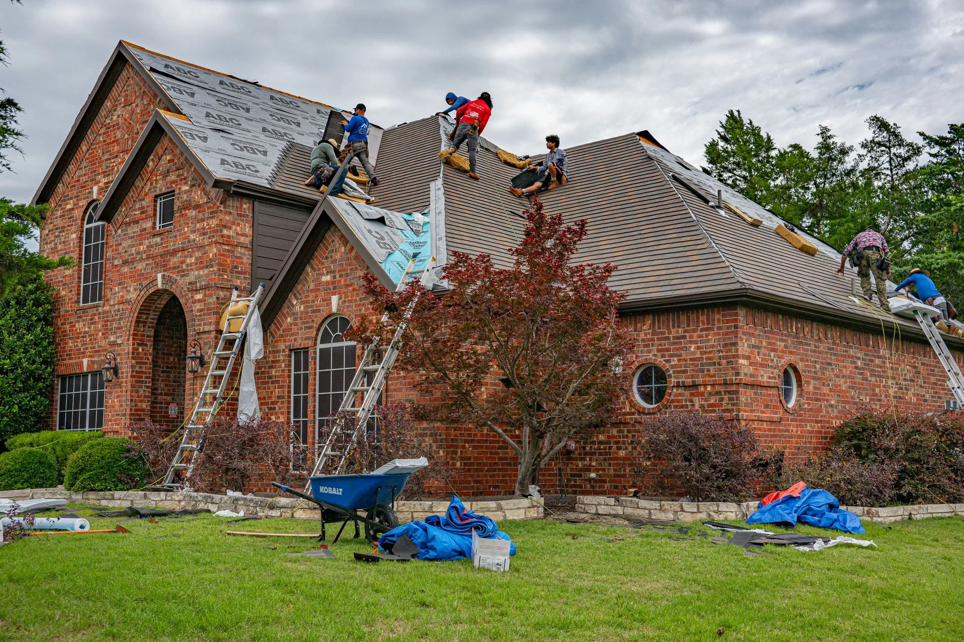 BH Roofing crew completing a full tear-off roof replacement on a Shaker Heights home